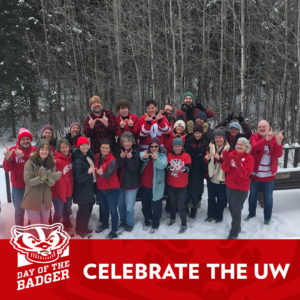 Wisconsin Sea Grant and Water Resources Institute staff wear their best Badger gear as they pose for a photo outside in the snow